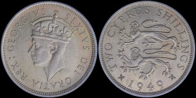 CYPRUS: 2 Shillings (1949) in copper-nickel with crowned head of King George VI facing left. Two stylized rampant lions, denomination and date on reve...