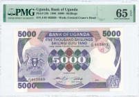 UGANDA: 5000 Shillings (1986) in purple and multicolor with Arms at left. S/N: "J/48 462669". WMK: Crested crane. Inside holder by PMG "Gem Uncirculat...