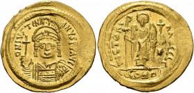 Justinian I, 527-565. Solidus (Gold, 22 mm, 4.47 g, 6 h), Constantinopolis, 545-565. D N IVSTINIANVS P P AVG Helmeted and cuirassed bust of Justinian ...