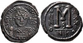 Justinian I, 527-565. Follis (Bronze, 32 mm, 17.61 g, 7 h), Nicomedia, RY 31 = 557/8. D N IVSTINIANVS P P AVI Helmeted and cuirassed bust of Justinian...