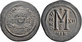 Justinian I, 527-565. Follis (Bronze, 43 mm, 21.19 g, 7 h), Nicomedia, RY 12 = 538/9. D N IVSTINIANVS P P AVI Helmeted and cuirassed bust of Justinian...