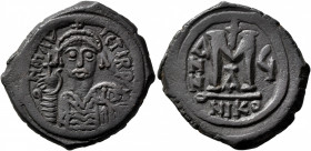 Maurice Tiberius, 582-602. Follis (Bronze, 30 mm, 11.59 g, 6 h), Nicomedia, RY 5 = AD 586/7. D N mAV IЄTI P P Helmeted and cuirassed bust of Maurice T...
