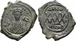 Phocas, 602-610. Follis (Bronze, 34 mm, 11.93 g, 6 h), Nicomedia, RY 4 = AD 605/6. δ m FOCA PER [AVς] Crowned bust of Phocas facing, wearing consular ...