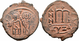 Phocas, 602-610. Follis (Bronze, 34 mm, 12.28 g, 6 h), Cyzicus, probably RY 1 = AD 602/3. Phocas, on the left, standing facing, holding globus crucige...