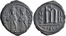 Phocas, 602-610. Follis (Bronze, 29 mm, 9.00 g, 6 h), with Leontia, Theoupolis (Antiochia), RY 4 = 605/6. O N FOCA NЄ PЄ AV Phocas standing facing, ho...