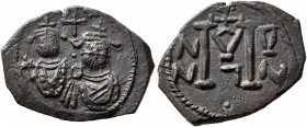ISLAMIC, Time of the Rashidun. Pseudo-Byzantine types. Fals (Bronze, 18x24 mm, 4.34 g, 1 h), uncertain mint, circa AH 29-49 AH / AD 650-670. Two beard...