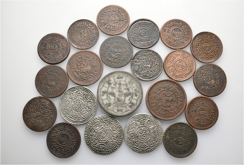 A lot containing 4 silver and 17 bronze coins. All: Tibet. About very fine to go...