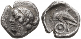 ISLANDS OFF THRACE, Thasos. Circa 412-404 BC. Hemiobol (Silver, 8 mm, 0.31 g, 6 h). Head of a nymph to left, wearing taenia. Rev. ΘA Dolphin left with...