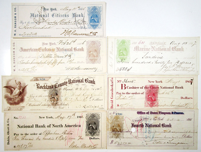 New York, 1866-1867. Lot of 7 Issued and cancelled bank checks from New York ban...