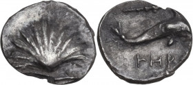Greek Italy. Southern Apulia, Tarentum. AR Hemilitron, c. 325-280 BC. Obv. Cockle shell. Rev. Dolphin right; above, club; below, I-HP. HN Italy 980; V...