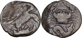 Sicily. Akragas. AR Hemidrachm, c. 420-410 BC. Obv. Eagle standing right on, and tearing at, hare; barley grain to left. Rev. Crab; below, ketos right...