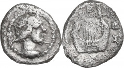 Sicily. Katane. AR Tetras, c. 415-412 BC. Obv. Laureate head of Apollo right; dotted border. Rev. Kithara; [A] - K across fields, three pellets (mark ...