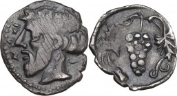 Sicily. Naxos. AR Litra, c. 461-430 BC. Obv. Head of Dionysos left, wearing ivy wreath; NAXI to right. Rev. Grape bunch on vine. HGC 2 972; SNG ANS 13...