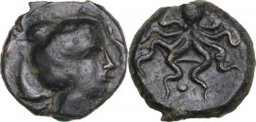 Sicily. Syracuse. Second Democracy. AE Tetras or Trionkion, c. 435-415 BC. Obv. SYPA. Head of Arethusa right, within two dolphins. Rev. Octopus; aroun...