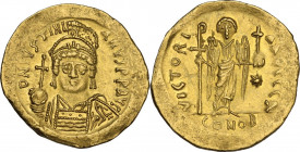 Justinian I (527-565). AV Solidus, Constantinople mint, 545-565 AD. Obv. DN IVSTINIANVS PP AVG. Helmeted and cuirassed bust facing, holding globus cru...