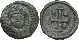 Justinian I (527-565). AE Decanummium, Ravenna mint, c. 552-565 AD. Obv. Helmeted and cuirassed bust facing, holding globus cruciger and shield. Rev. ...