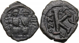 Justin II (565-578). AE Half Follis, Nicomedia mint. Obv. DN IVSTINIANVS PP AV (ligate) G. Justin and Sophia seated facing on double throne; between t...