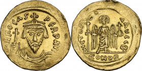 Phocas (602-610). AV Solidus. Constantinople mint, 2nd officina. Struck 603-607. Obv. ∂N FOCAS PЄRP AVC. Crowned and cuirassed facing bust facing, hol...