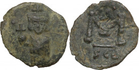 Justinian II. First Reign (685-695 AD). AE Follis, 687-689 AD. Syracuse mint. Obv. Justinian, with slight beard, standing facing, wearing crown and ch...