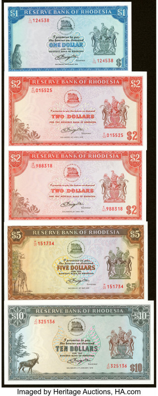 Rhodesia & Uganda Group Lot of 10 Examples Crisp Uncirculated. Red overprints ar...