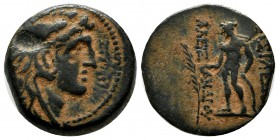 Seleukid Kingdom. Alexander I Balas. 152-145 BC. AE (18mm, 6.26g). Antioch mint. Head right wearing lion skin / Apollo standing left, holding arrow an...