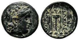 Seleukid Kingdom. Antiochos II Theos. 261-246 BC. AE (18mm, 4.65g). Sardes mint. Laureate head of Apollo right. / Tripod; monogram to outer left and r...