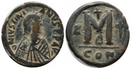 Justin I & Justinian I. 527. AE Follis – 40 Nummi (30mm, 16.64g). Constantinople mint, 4th officina. Diademed, draped, and cuirassed bust of Justin ri...