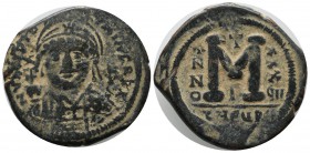 Justinian I. 527-565. AE Follis (31mm, 19.53g). Theoupolis (Antioch) mint. Dated RY 37. VN CΛIL ΛLNPΛON, helmeted and cuirassed bust facing, holding g...