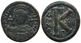 Justinian I. AD 527-565. AE 20 Nummi (30mm, 10.82g). Theoupolis (Antioch), year 13 (539/40). Helmeted and cuirassed bust facing, holding globus crucig...