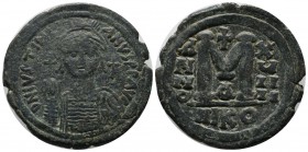 Justinian I. AD 527-565. AE Follis (35mm, 20.14g). Nicomedia. D N IVSTINIANVS P P AVC. Helmeted, draped and cuirassed bust facing, holding globus cruc...