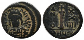 Justinian I. AD 527-565. AE Nummi (19mm, 3.97g). Theoupolis (Antioch) mint, 4th officina. Dated RY 24 (550/1). Crowned and cuirassed facing bust, hold...