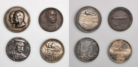 GERMANY. Weimar Republic. Quartet of Silver & Bronze Medals (4 Pieces). 1928. Average Grade: UNCIRCULATED.

1) Silver Medal, 1908. Zeppelin over Str...