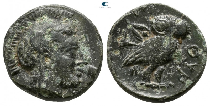 Akarnania. Thyrrheion 350-300 BC. 
Bronze Æ

13mm., 2,61g.

Helmeted head o...