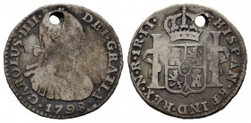 Charles IV (1788-1808). 1 real. 1798. Santa Fe de Nuevo Reino. JJ. (Cal-494). (Restrepo-78.24). Ag. 3,50 g. Usual condition for this mint. Holed. Very...