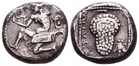 CILICIA, Soloi. Circa 440-410 BC. AR Stater. Amazon kneeling left, holding bow, quiver on left hip; head of satyr to right / Grape cluster on vine; fl...