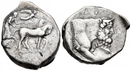 SICILY. Gela. Circa 450-440 BC. Tetradrachm (Silver, 30 mm, 16.67 g, 10 h). Quadriga driven slowly to right by a bearded charioteer; above, Nike flyin...