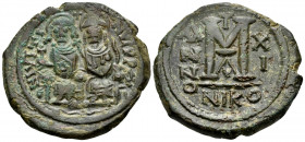 Justin II, with Sophia, 565-578. Follis (Bronze, 30 mm, 12.80 g, 7 h), Nicomedia, 1st officina (A), year 11 = 575-576. Justin and Sophia seated facing...