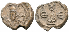BYZANTINE SEALS, Ecclesiastical. Theodoros, circa 7th century. Seal or Bulla (Lead, 23 mm, 10.35 g, 1 h). Nimbate and facing bust of St. Basilios, hol...