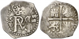 1589/8. Felipe II. Sevilla. . 1/2 real. (Cal. falta). 1,58 g. Monograma entre S/y fecha de dos dígitos en vertical. Pequeña raspadura en anverso. Rara...