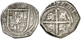 1597. Felipe II. Sevilla. B. 1 real. (Cal. 676). 3,42 g. Tipo "OMNIVM". Fecha en reverso. Rara. MBC-.