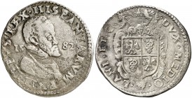 1582. Felipe II. Milán. 1 escudo. (Vti. 50 var) (MIR. 308/11). 31,43 g. Fecha en campo del anverso. Busto pequeño. Rayitas. Ex Isabel de Trastámara 26...