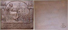 Plakieta autorstwa Wysockiego z 1927 roku, poświęcona Archiwum Archidiecezjalnemu w Poznaniu.