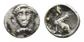 CILICIA. Uncertain. (Early-mid 4th century BC). AR Tetartemorion.
Obv: Head of Baal facing.
Rev: Sphinx seated left, with her right forepaw raised....
