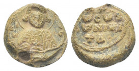 PB Byzantine lead seal. Seal of Niketas (11th century).
Obv: Half-length of St Niketas holding the martyr's cross. Traces of epigraphy on either side...
