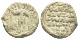 PB Byzantine lead seal. Seal of Alexandros Palaiologos, proedros (1070s-1080s).
Obv: Bust of St. Demetrios, holding a spear with his right hand and r...