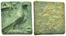AE Bronze Hellenistic balance weight, Troas Abydos, tetarton.
Rectangular in form with rounded corners.
Obv: Eagle standing r., kerikeion in the r.,...