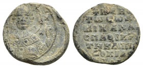 PB Byzantine lead seal. Seal of Michael protospatharios, judge of the Hippodrome. (11th century)
Obv: Facing bust of St. Michael the Archangel, holdi...