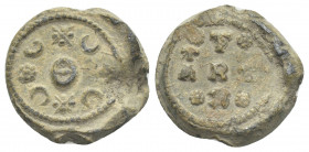 PB Byzantine lead seal. (c. 10th century).
Obv: Decorations surrounding large Θ. Border of dots.
Rev: Inscription in the form of a cross with a clus...