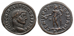 Diocletian (284-305). Æ Follis (28mm, 11.00g, 12h). Ticinum, 296-7. Laureate head r. R/ Genius standing l., holding patera and cornucopia; star/-//PT....