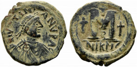 Justin I and Justinian I (AD 527). Æ 40 Nummi (30mm, 16.99g). Nicomedia. Diademed, draped and cuirassed bust of Justin r. R/ Large M; cross above, cro...